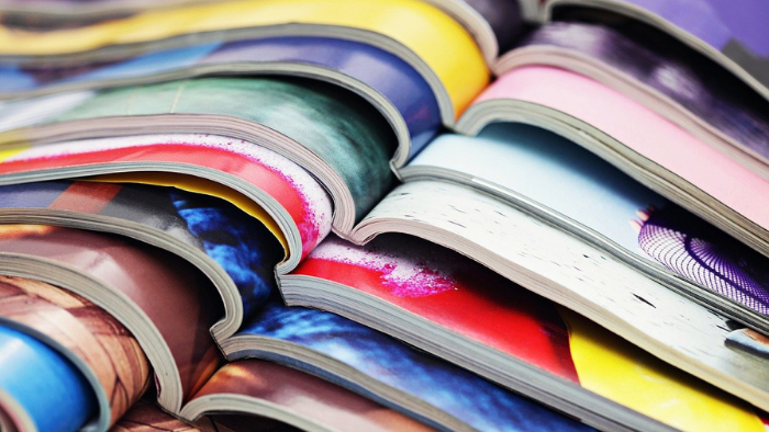 Media News Recap - Stack of open magazines