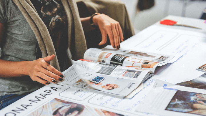 Woman flipping through a magazine