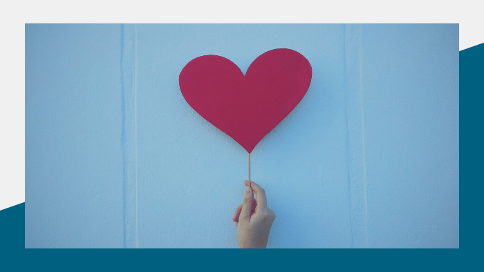 Heartfelt Blogs - Person holding a heart-shaped paper cutout