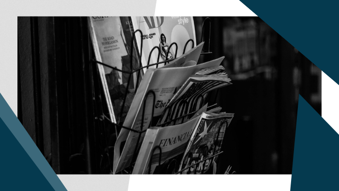 Selection of newspapers, magazines on an "International Press" rack