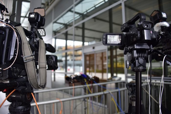 News cameras stationed by interview location