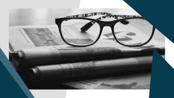 Media Insider - Eyeglasses sitting on top of folded newspapers