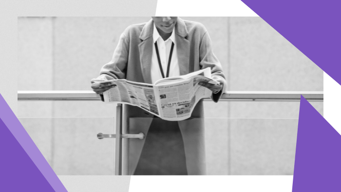 Media Insider - Businesswoman reading a newspaper