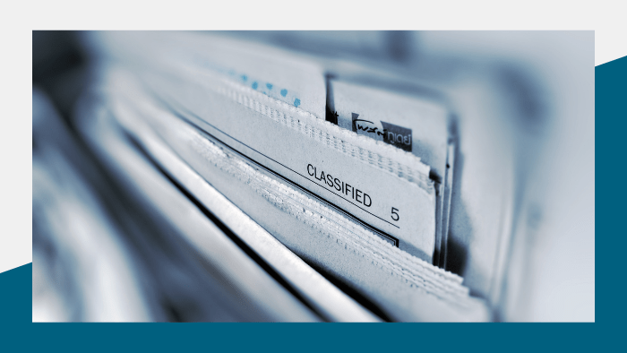 Media Insider - Closeup of a stack of newspapers and the Classified page