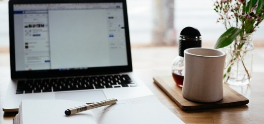 Open notebook and laptop on a desk