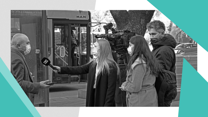 Women in Media - A female reporter and camera crew interviewing a man